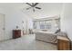 Bright and airy bedroom with vaulted ceilings, neutral carpet, and ample natural light from the windows at 2864 S Jebel Way, Aurora, CO 80013