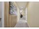 Well-lit hallway with neutral-colored walls and plush carpeting, connecting different areas of the home for easy navigation at 2864 S Jebel Way, Aurora, CO 80013
