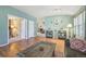 Bright living room with hardwood floors, neutral walls, and a glimpse into the adjoining rooms for seamless flow at 2864 S Jebel Way, Aurora, CO 80013