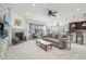 Open living room and dining area with hardwood floors and natural light, creating a welcoming and bright space at 2864 S Jebel Way, Aurora, CO 80013