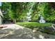 Fenced backyard with grass, mature trees and shed at 11625 Bellaire Way, Thornton, CO 80233