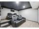 Basement theater room with comfortable seating at 11625 Bellaire Way, Thornton, CO 80233