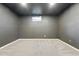 Finished basement featuring neutral carpeting, paint and trim, and a window providing natural light at 11625 Bellaire Way, Thornton, CO 80233