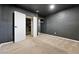 Finished basement featuring neutral carpeting, paint and trim and a walk-in closet at 11625 Bellaire Way, Thornton, CO 80233