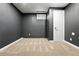 Finished basement featuring neutral carpeting, paint and trim, and a window providing natural light at 11625 Bellaire Way, Thornton, CO 80233