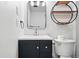 Bathroom with vanity, modern mirror and light fixture, and toilet at 11625 Bellaire Way, Thornton, CO 80233