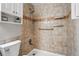 Shower and toilet inside of a beautifully tiled bathroom at 11625 Bellaire Way, Thornton, CO 80233