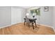 Bedroom with hardwood floors, a desk, and natural light from the window at 11625 Bellaire Way, Thornton, CO 80233