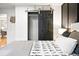 View of bedroom closet with stylish sliding barn door at 11625 Bellaire Way, Thornton, CO 80233