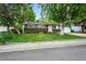 Charming single-story home with a well-manicured front lawn and attached two car garage at 11625 Bellaire Way, Thornton, CO 80233