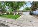 Charming single-story home with a well-manicured front lawn and attached two car garage at 11625 Bellaire Way, Thornton, CO 80233
