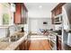 Efficient kitchen area with updated countertops and direct access to the dining area at 11625 Bellaire Way, Thornton, CO 80233