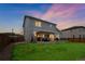 Beautiful backyard with a large patio, pergola, and lush green grass at 6954 E 117Th Ave, Thornton, CO 80233