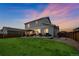 Scenic backyard with a patio, pergola, and a well-maintained lawn at 6954 E 117Th Ave, Thornton, CO 80233