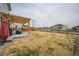Spacious backyard with patio, pergola, seating, and wooden fence at 6954 E 117Th Ave, Thornton, CO 80233