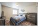 Comfortable bedroom with a cozy bed, window with shutters, and neutral decor at 6954 E 117Th Ave, Thornton, CO 80233