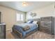 Serene bedroom with window, soft carpet, and a relaxing atmosphere at 6954 E 117Th Ave, Thornton, CO 80233