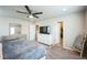 Spacious bedroom featuring a ceiling fan, dresser, and closet access at 6954 E 117Th Ave, Thornton, CO 80233