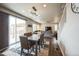 Bright dining area with sliding door access to outdoor space, connecting to a spacious living area at 6954 E 117Th Ave, Thornton, CO 80233