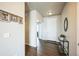 Inviting entryway featuring wood-look floors and neutral walls, illuminated by overhead lighting at 6954 E 117Th Ave, Thornton, CO 80233