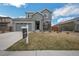Charming two-story home with manicured lawn, a two-car garage, and a For Sale sign at 6954 E 117Th Ave, Thornton, CO 80233