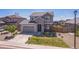 Attractive two-story home with a two-car garage, landscaping, and a well-maintained front lawn at 6954 E 117Th Ave, Thornton, CO 80233