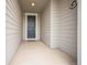 Inviting front entrance with a dark teal door and neutral siding creating curb appeal at 6954 E 117Th Ave, Thornton, CO 80233