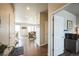 Welcoming entry hallway that leads into an open living area and dining area with lots of natural light at 6954 E 117Th Ave, Thornton, CO 80233