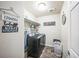 Functional laundry room with modern appliances, shelving, and laundry-themed decor at 6954 E 117Th Ave, Thornton, CO 80233