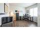 Bright home office with wood floors, desk, chair, storage, and natural light at 6954 E 117Th Ave, Thornton, CO 80233