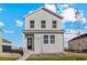 Charming two-story home with white siding, well-maintained landscaping and inviting front porch at 2974 Oxley St, Strasburg, CO 80136