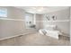 Neutral bedroom with a window seat, carpet and modern decor at 10247 Telluride Way, Commerce City, CO 80022
