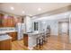 Kitchen with stainless steel appliances, granite countertops, and center island seating at 10247 Telluride Way, Commerce City, CO 80022