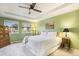 Calming bedroom with tray ceiling, carpeted floors, and ample natural light at 10247 Telluride Way, Commerce City, CO 80022