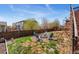 Backyard featuring a fire pit surrounded by seating and grass at 4464 E 139Th Ave, Thornton, CO 80602