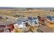 Aerial view of neighborhood homes featuring solar panels, landscaped yards, and well-kept lawns at 4464 E 139Th Ave, Thornton, CO 80602