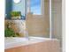 This bathroom features a soaking tub, a mounted TV, and a separate glass shower at 4464 E 139Th Ave, Thornton, CO 80602