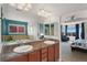 Bright bathroom features double sinks, soaking tub, and shower with views into the connected bedroom at 4464 E 139Th Ave, Thornton, CO 80602