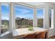 Sunlit breakfast nook with a large window, hardwood floors, and seating for four at 4464 E 139Th Ave, Thornton, CO 80602