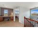 Upstairs hallway with built-in desk and easy access to all the bedrooms at 4464 E 139Th Ave, Thornton, CO 80602