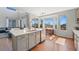 Bright and modern kitchen featuring a central island, stainless appliances, and a large window at 4464 E 139Th Ave, Thornton, CO 80602