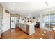 Spacious kitchen with an island, stainless steel appliances, and seamless flow to other living areas at 4464 E 139Th Ave, Thornton, CO 80602