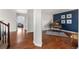 Spacious living room with hardwood floors, piano, and an open floor plan at 4464 E 139Th Ave, Thornton, CO 80602