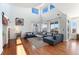 Bright living room boasts soaring ceilings, large windows, and stylish furnishings at 4464 E 139Th Ave, Thornton, CO 80602