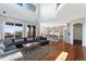 Open-concept living room with soaring ceilings, seamless transition to the kitchen at 4464 E 139Th Ave, Thornton, CO 80602