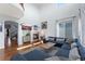 Spacious living room with a fireplace, TV and large sofa under high ceilings at 4464 E 139Th Ave, Thornton, CO 80602