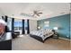 Spacious main bedroom with tray ceiling, accent wall, and ample natural light at 4464 E 139Th Ave, Thornton, CO 80602