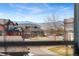 View from window of a quiet street with well-maintained homes and beautiful mountain views at 4464 E 139Th Ave, Thornton, CO 80602