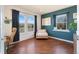 Bright office with large windows, hardwood floors and soothing blue accent wall at 4464 E 139Th Ave, Thornton, CO 80602