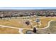 Aerial view of a community park featuring a playground, walking paths and a gazebo at 4464 E 139Th Ave, Thornton, CO 80602